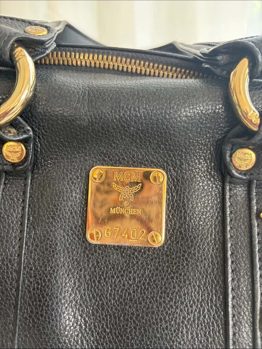 MCM Black Leather Satchel with Gold Hardware Accents